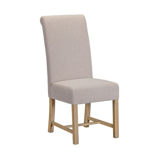 An upholstered dining chair with a tall backrest, light beige textured fabric, and light natural pine wood legs.