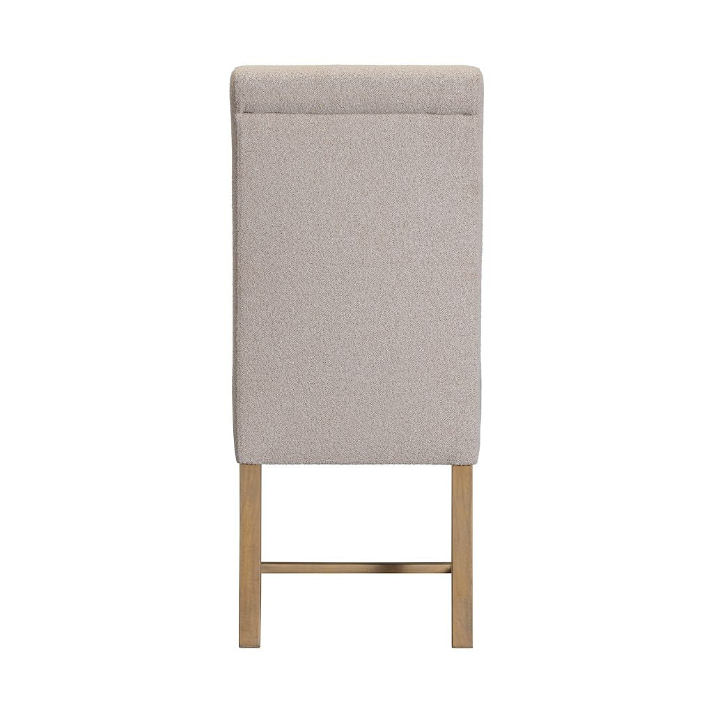 A tall, rectangular upholstered chair back viewed from the back, featuring a textured light beige fabric and pine wood legs