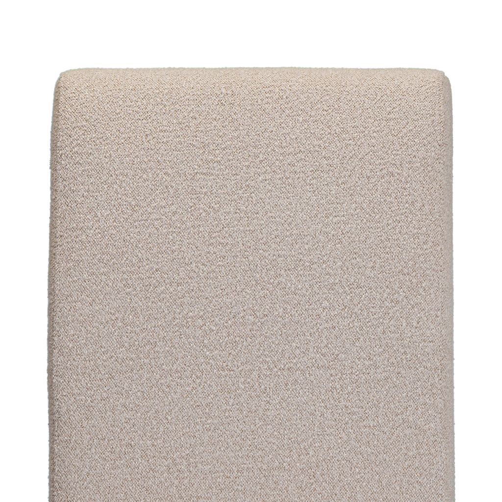 A close up of the beautiful beige fabric used on the chateau chair 