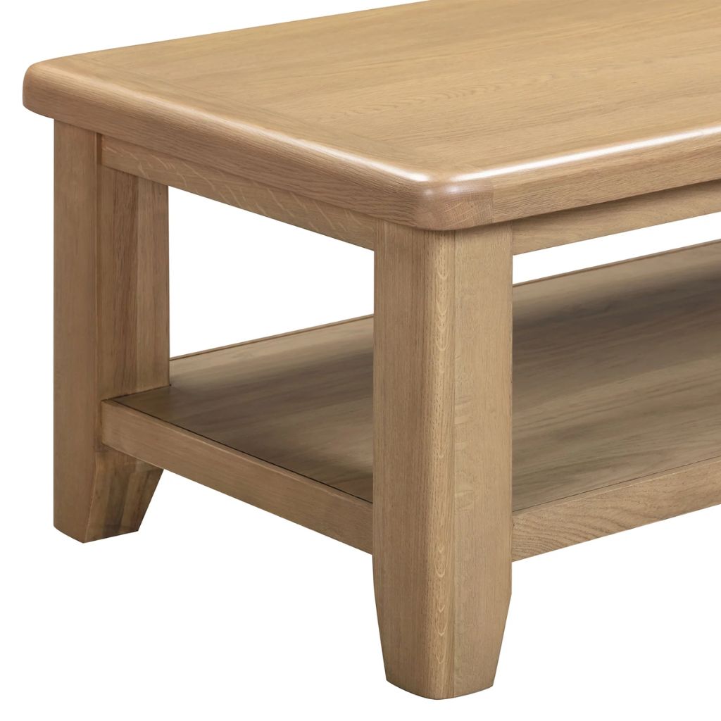 Wooden coffee table with a shelf on a white background