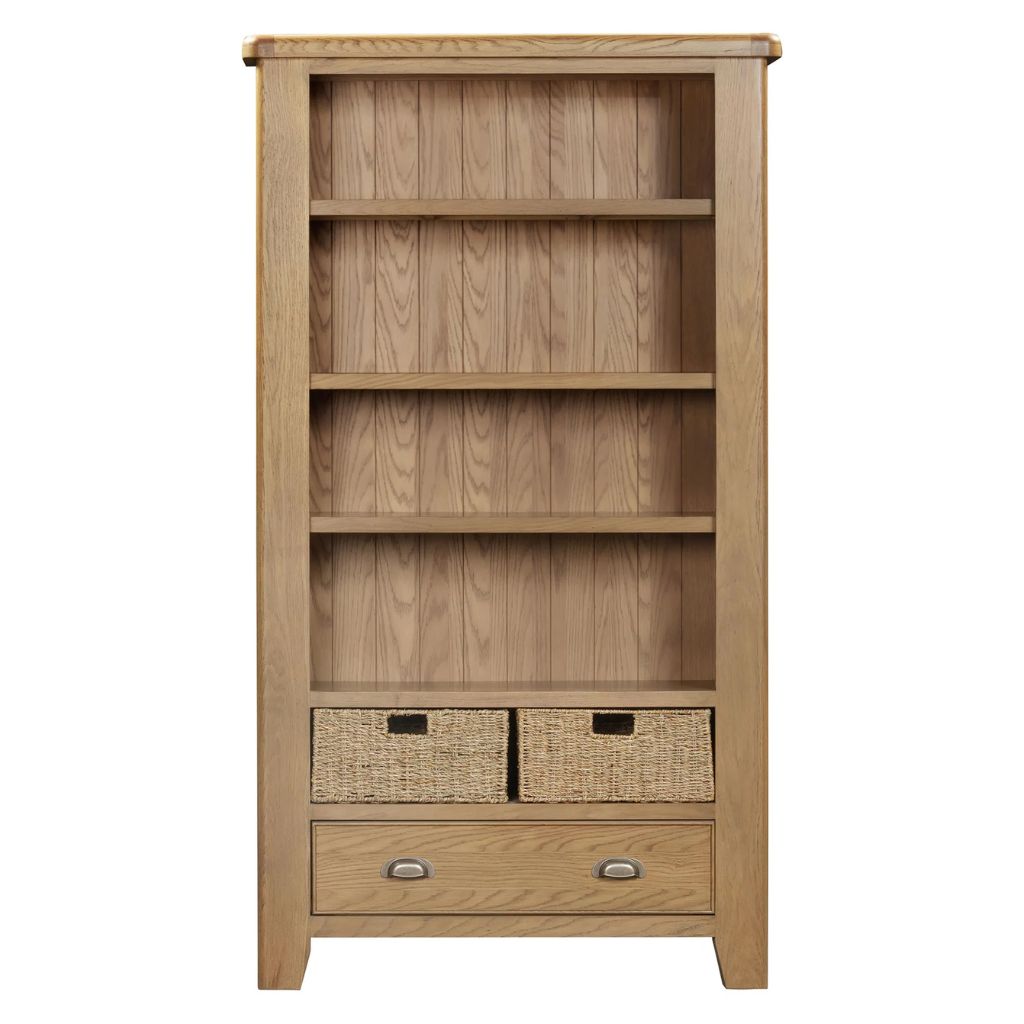 Wooden bookshelf with wicker baskets and drawers on a white background