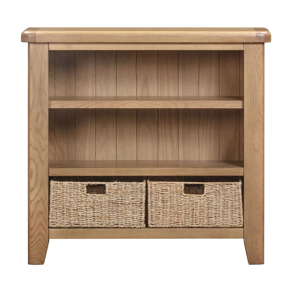 Wooden bookshelf with two woven basket drawers on a white background
