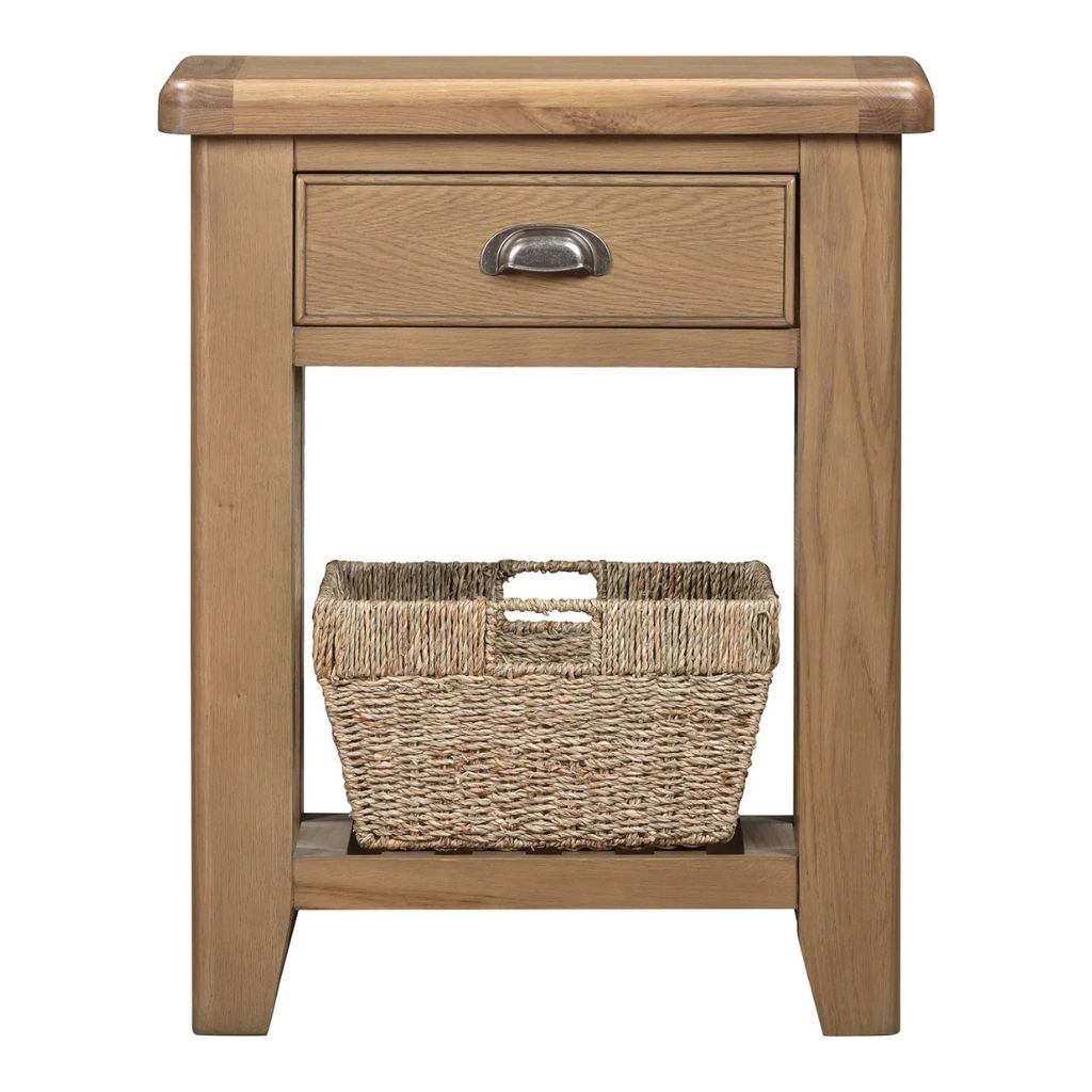 Wooden side table with a drawer and a woven basket on a white background