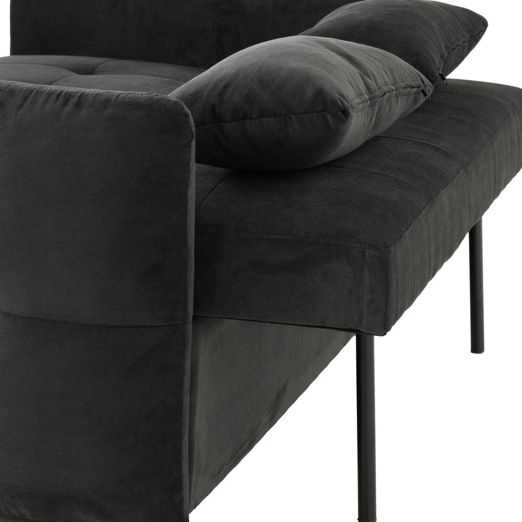 The Headrest folds down and is supported by two poles to extend the bed out further.