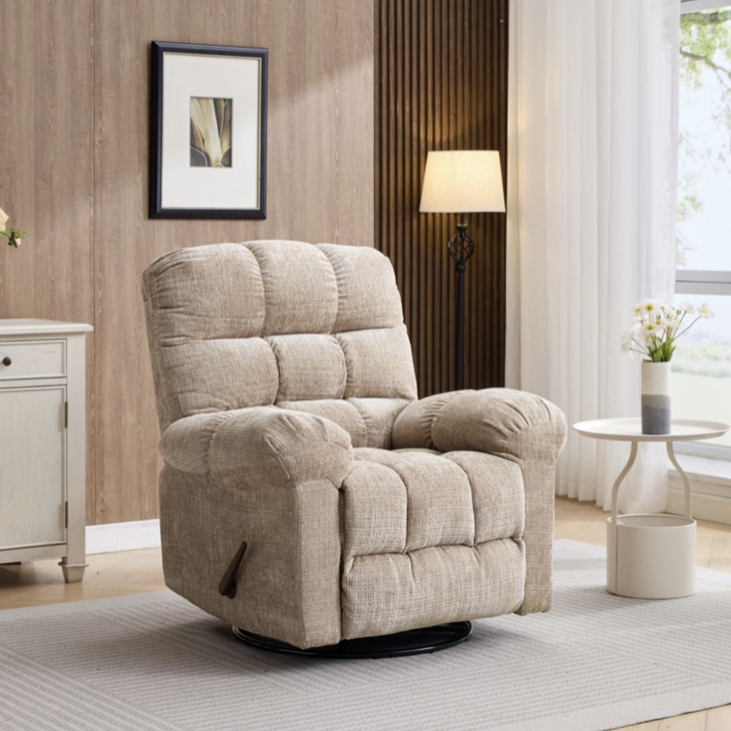 Beige recliner chair in a living room setting with a lamp and window in the background.