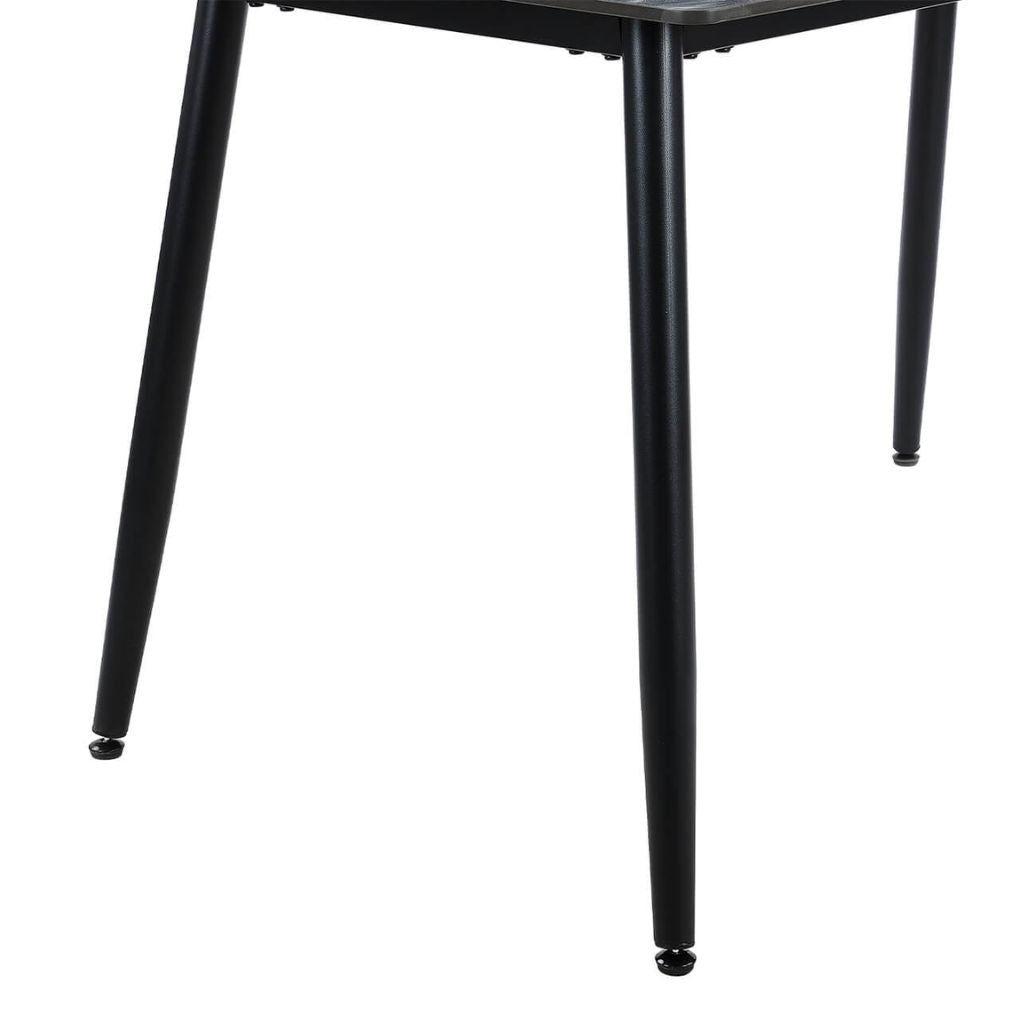 Close-up of a black metal table leg 