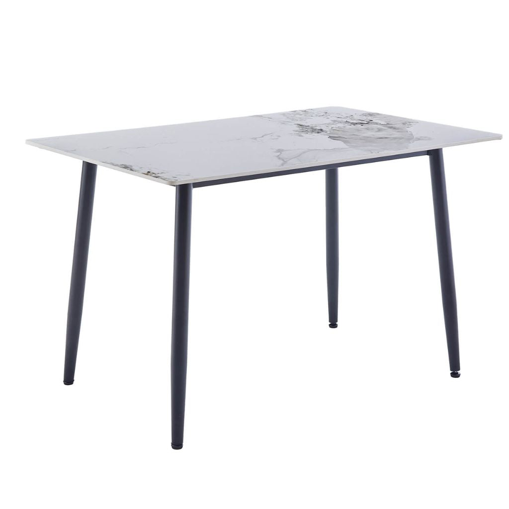 A rectangular dining table with a white sintered stone top and four black tapered metal legs.
