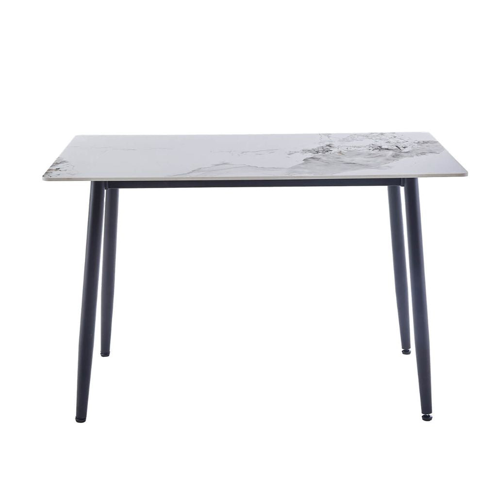 A rectangular dining table with a white sintered stone top and four black metal legs.