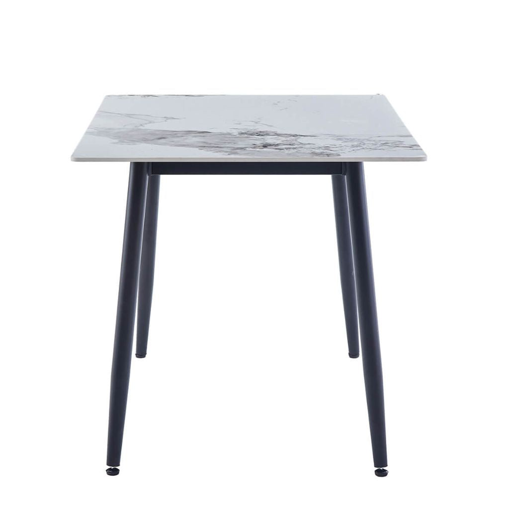 Side view of the Cody 1.6 sintered stone dining table in white.