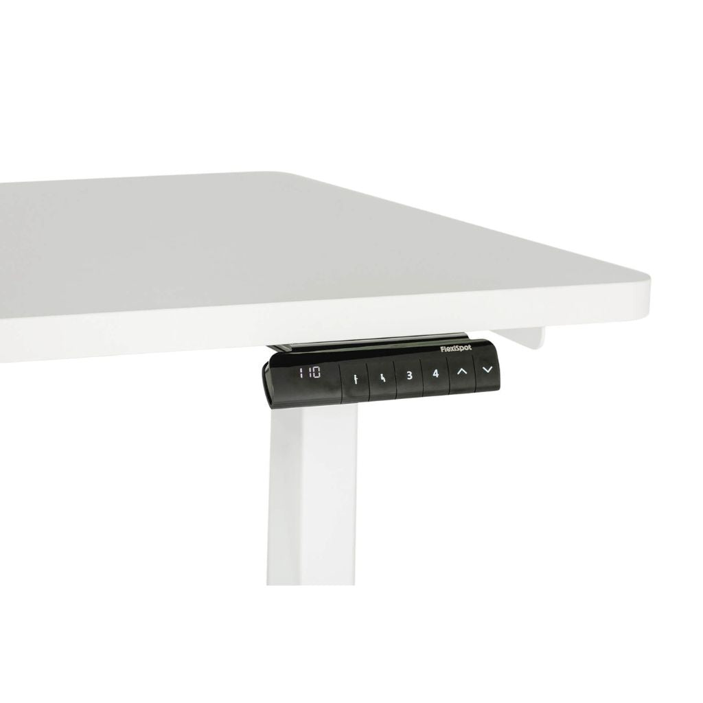 White adjustable desk with a remote control on a white background