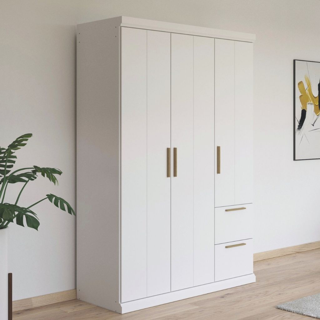 White wardrobe with oak handles in a room with a plant and wall art.