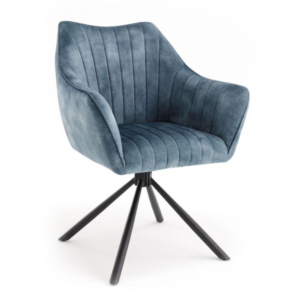 Blue velvet armchair with black metal legs on a white background