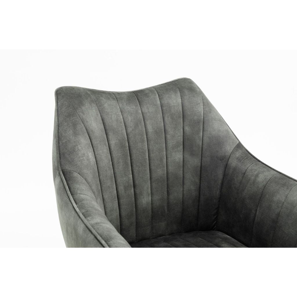 Green cushioned chair on a white background