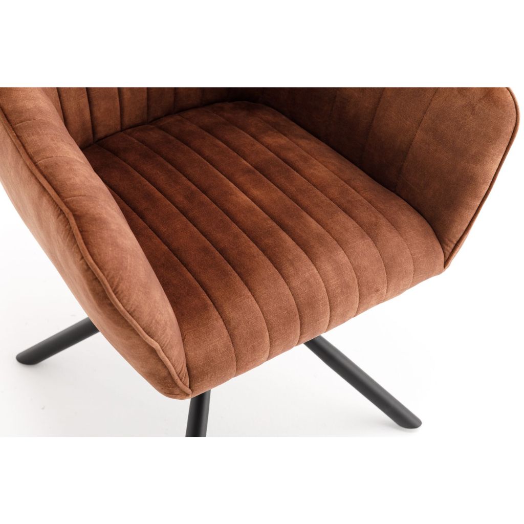 Rust  velvet armchair with black metal legs on a white background