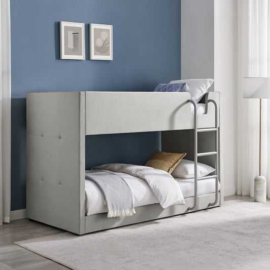 Gray bunk bed in a room with blue walls and white decor