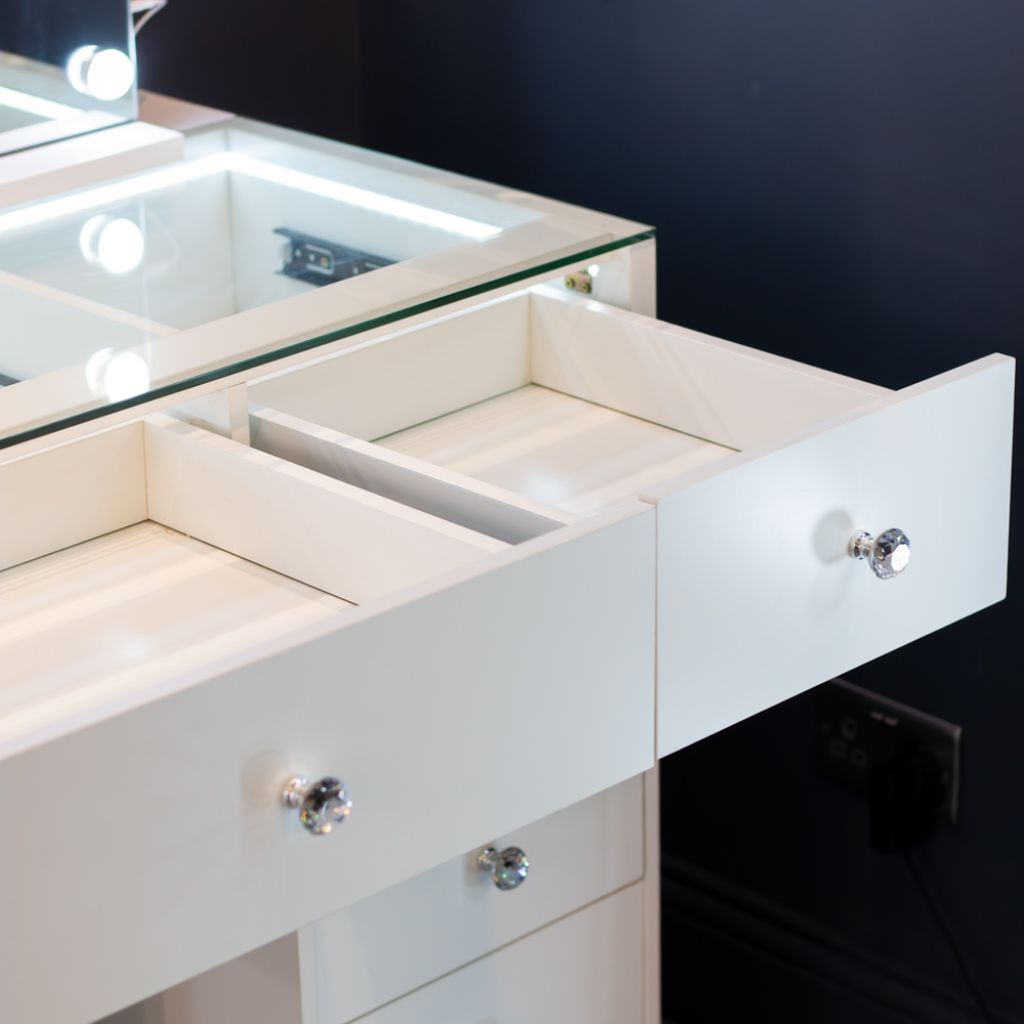 Drawers of dressing table with crystal-style knobs.