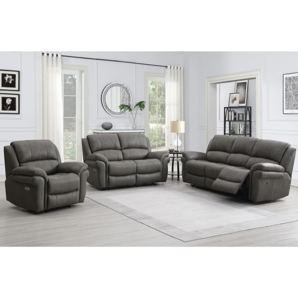 Gray reclining sofa set in a living room with white walls and large windows.