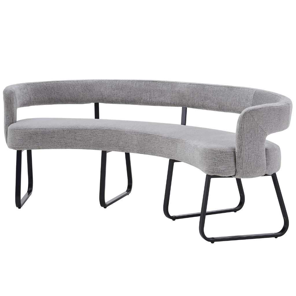 A curved upholstered dining bench with light grey textured fabric and black metal legs