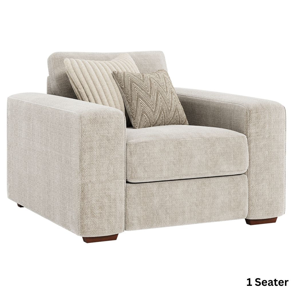 Beige armchair with patterned cushions.
