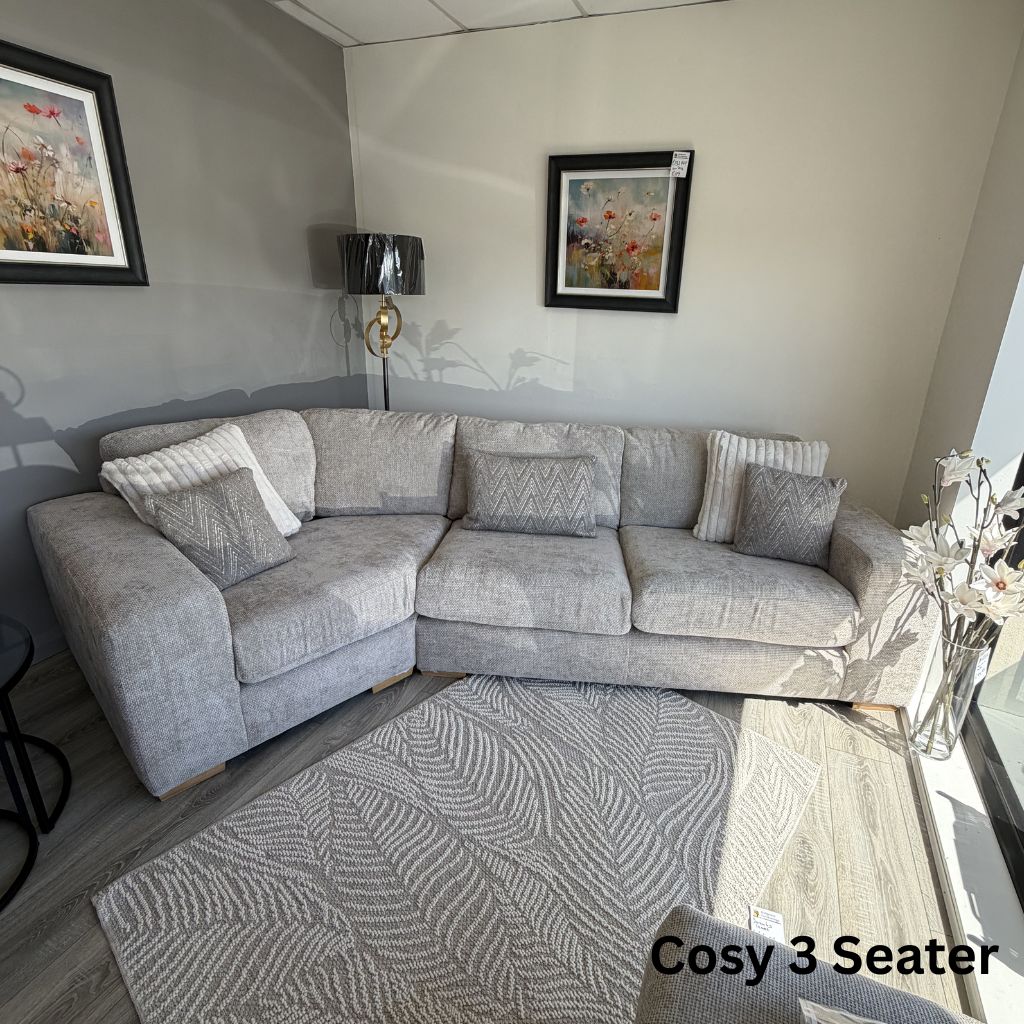 Grey sectional sofa in a living room with decorative elements.