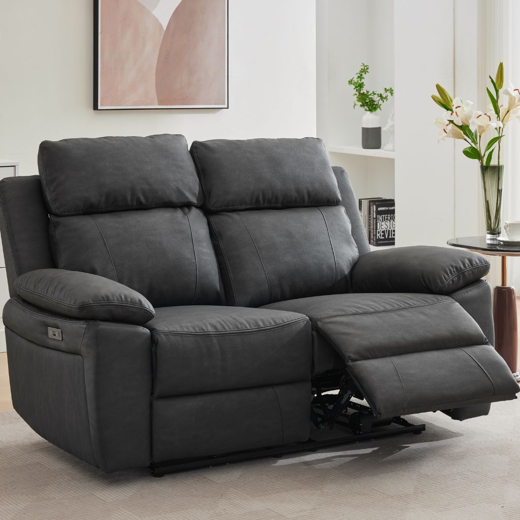 A dark grey two-seater electric reclining sofa 