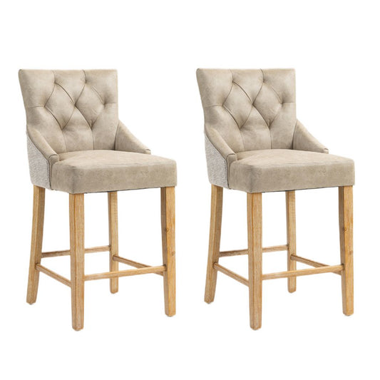 Two matching upholstered bar stools with tufted back cushions. Light beige fabric backs and natural wood legs.