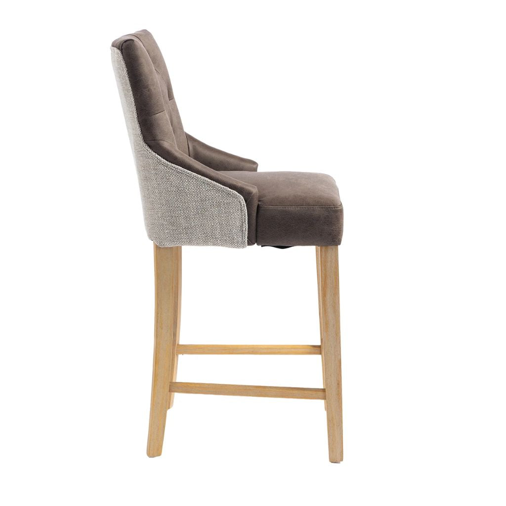 Bar stool with brown faux leather cushioned seat