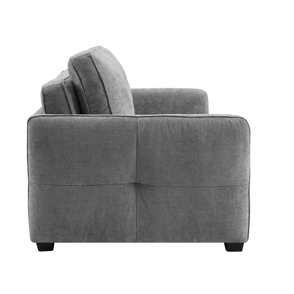 Side view showcasing the gorgeous details pin the sofa with beautiful pin tuck styling on the arms.