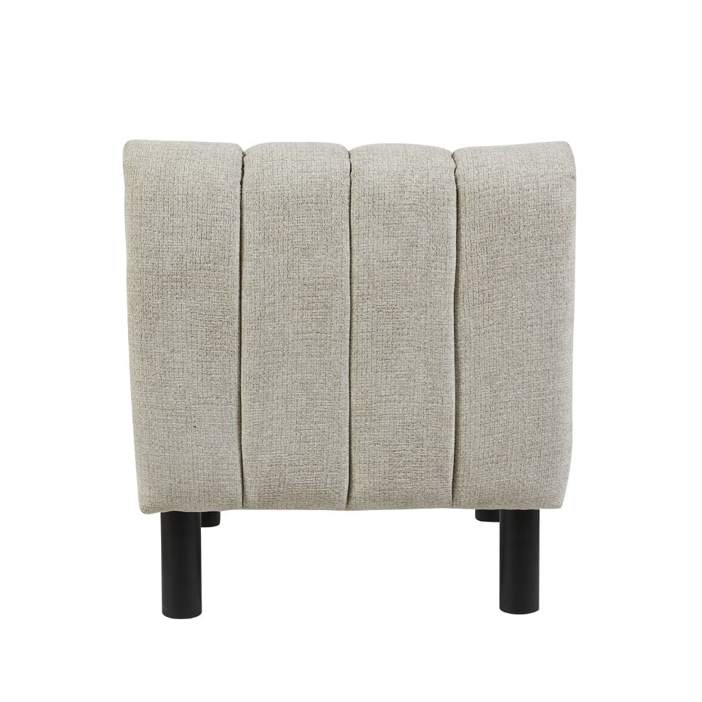 back view of the lily accent chair showcasing the stunning vertical channel stitching.