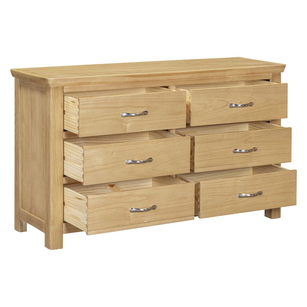 Wooden dresser with six drawers on a white background