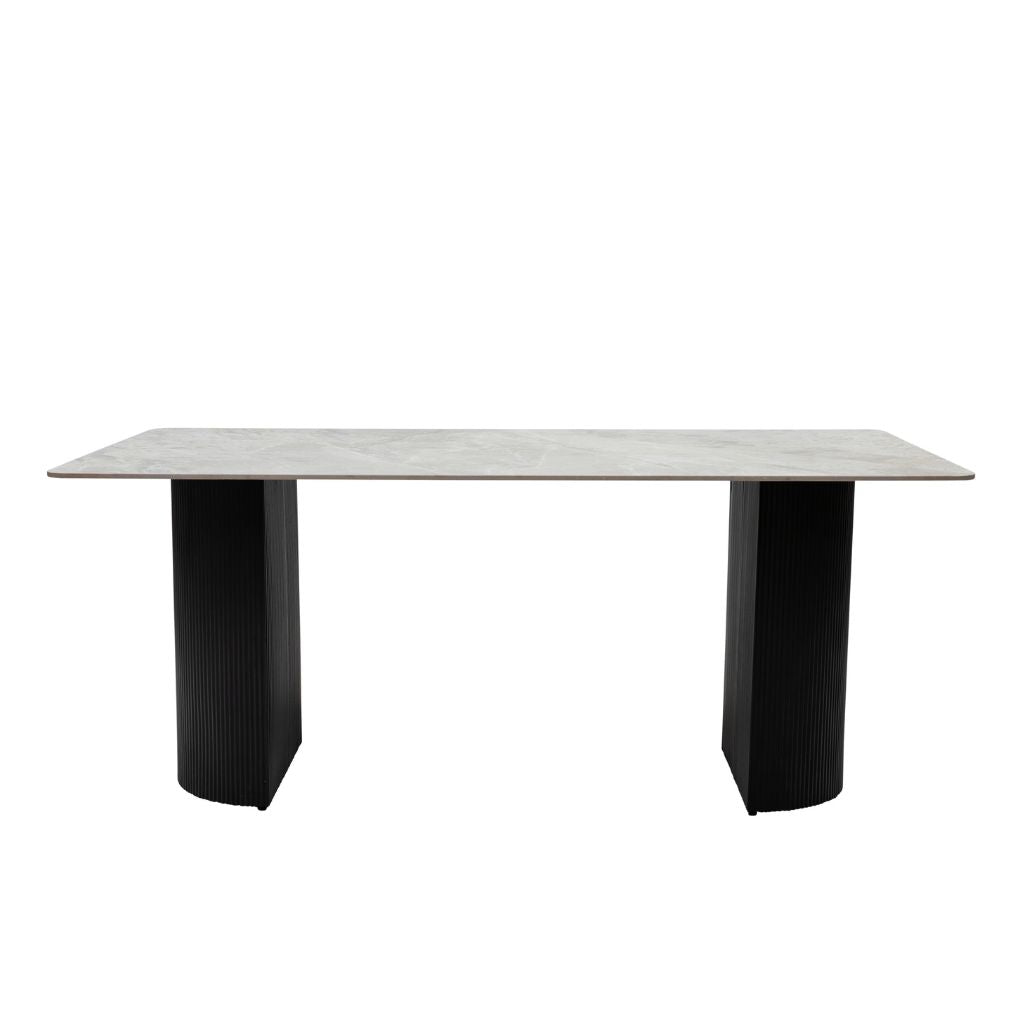 Rectangular table with a light gray top and black legs on a white background