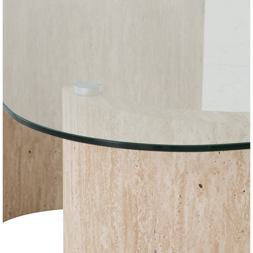 Round glass-top table with beige stone base