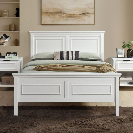 A beautiful white wooden bedframe with stunning panelling detail on headboard and footboard.