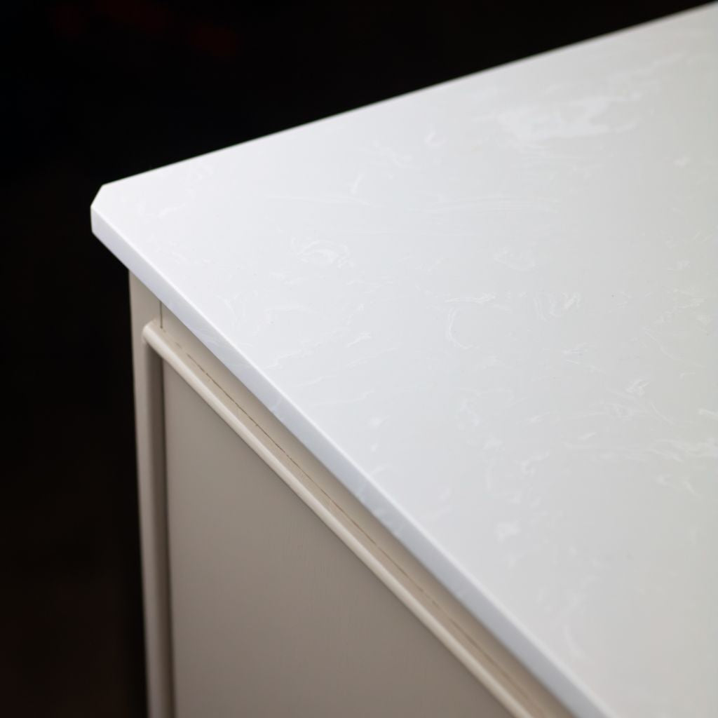 Close-up of a white countertop on a dark background