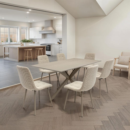Modern kitchen and dining area with a table and chairs.