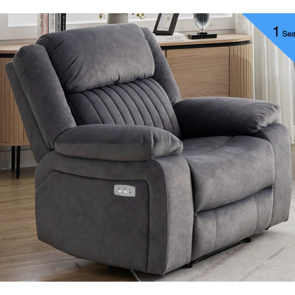 Gray recliner chair in a room with wooden furniture.