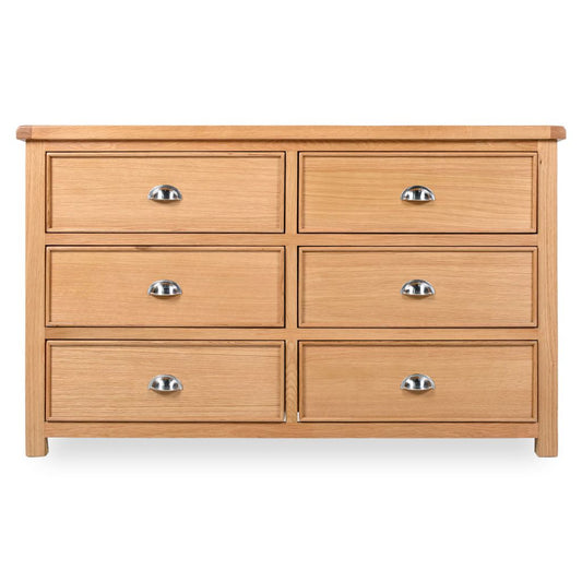 Wooden dresser with six drawers on a white background