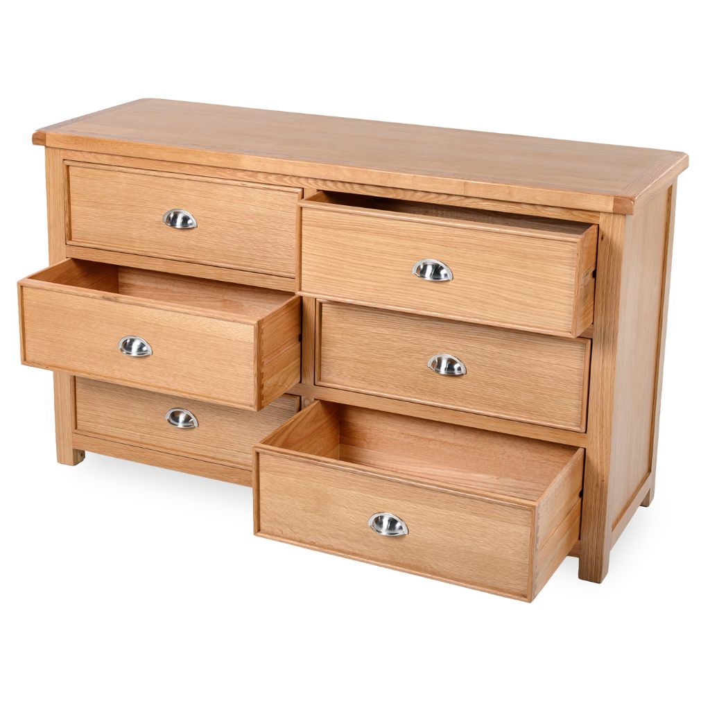 Wooden dresser with multiple drawers on a white background