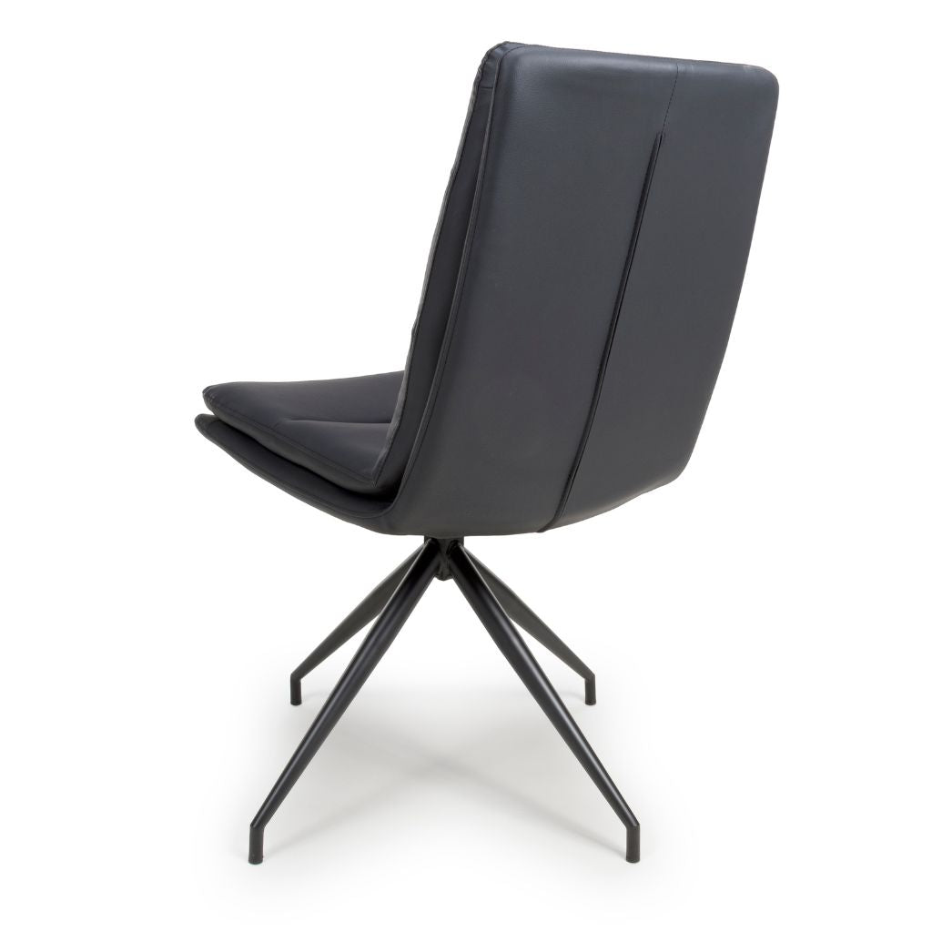Black leather chair with metal base on a white background