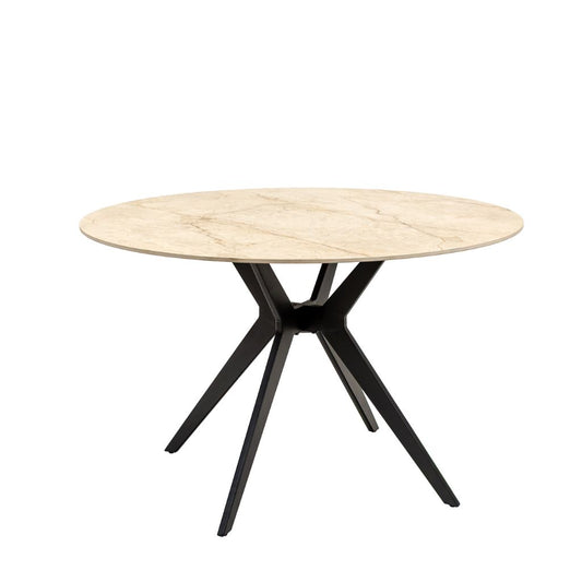 A round dining table with a Shakespeare Taupe sintered stone top and a black metal X-shaped pedestal base. 