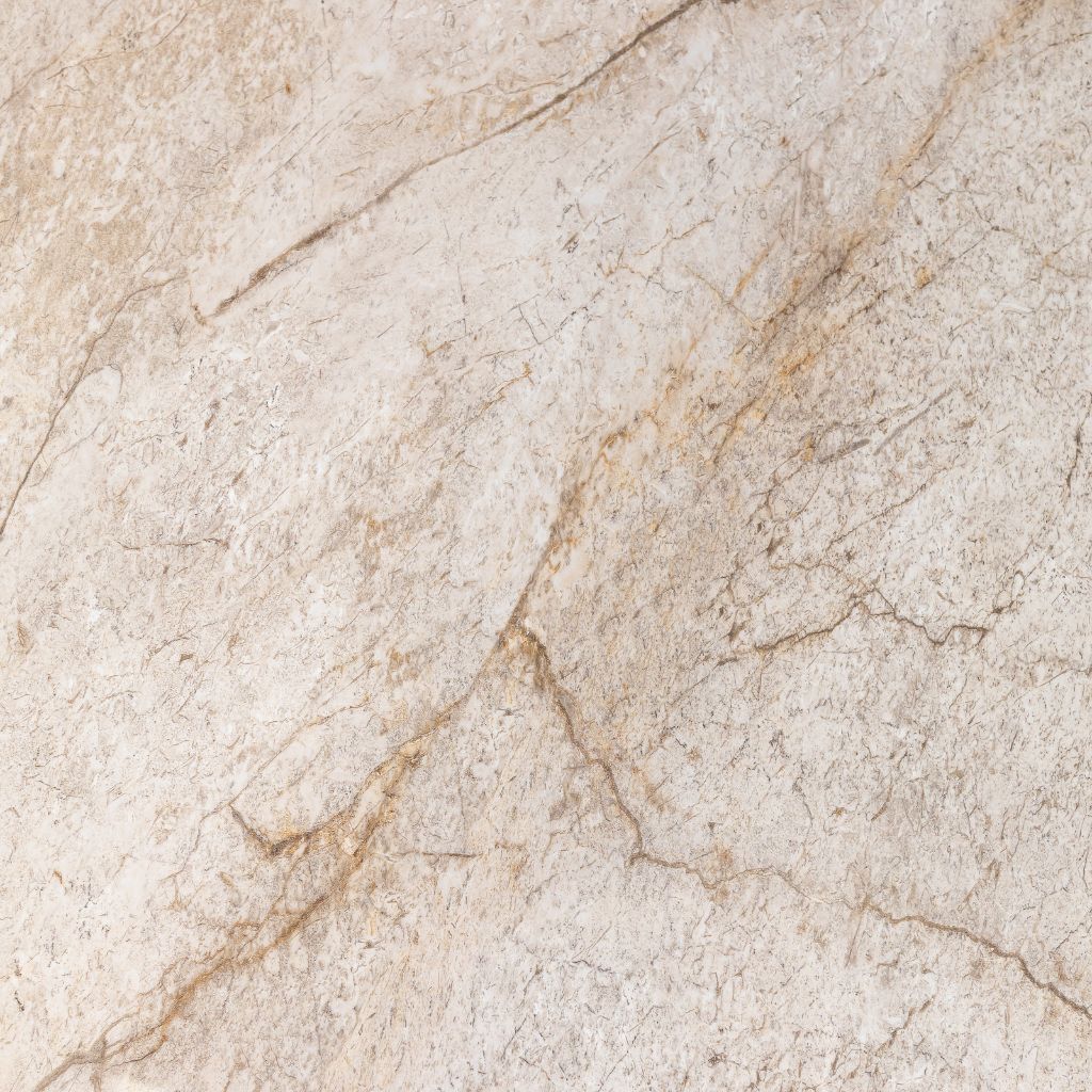 Beige sintered stone with natural brown and tan veining across the surface.