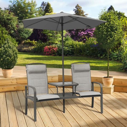 Outdoor patio set with two chairs and a table under a large umbrella on a wooden deck.
