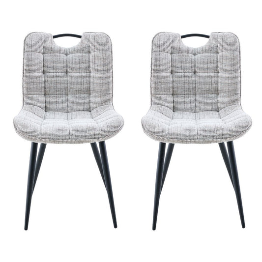 Two biscuit cushioned chairs with black legs on a white background