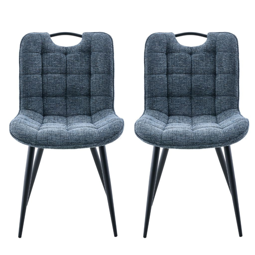 Two blue upholstered chairs with quilted seats on a white background