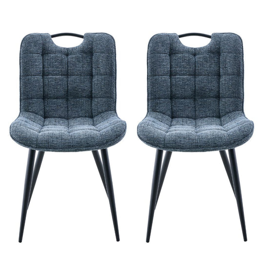 Two blue upholstered chairs with quilted seats on a white background