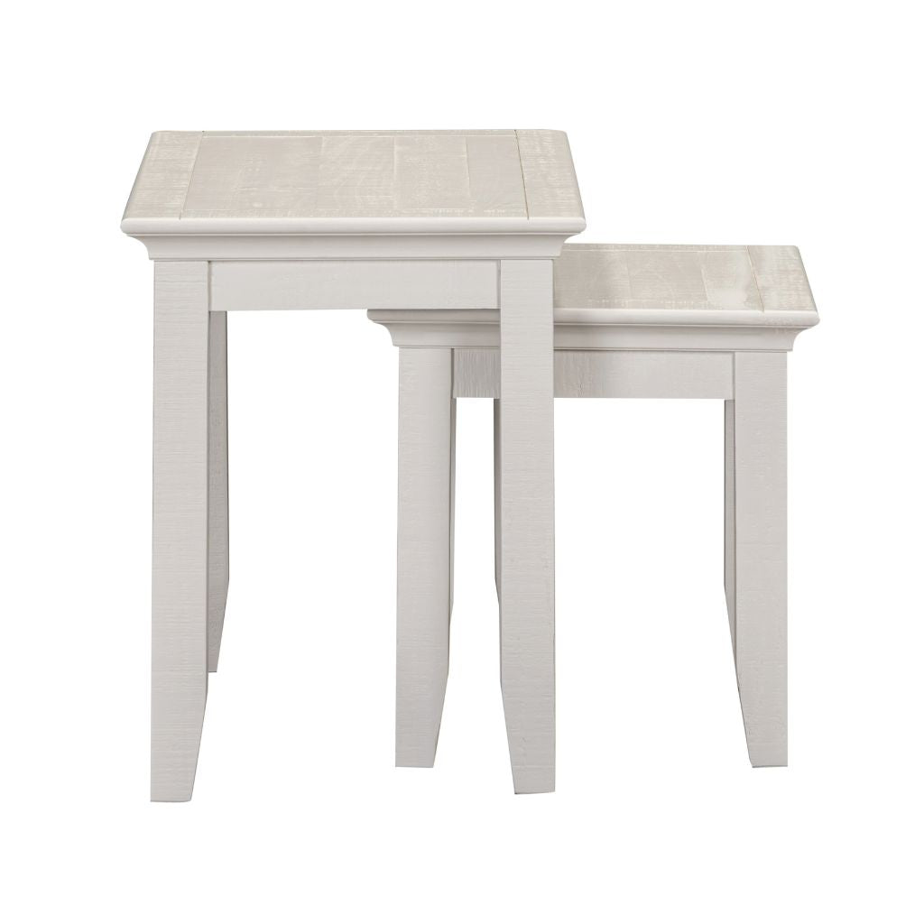 Two beige nesting tables on a white background