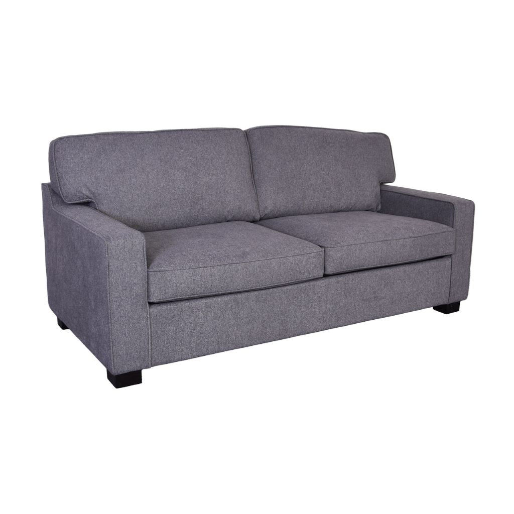 A grey upholstered sofabed with two seat cushions and two back cushions.