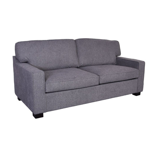 A grey upholstered sofabed with two seat cushions and two back cushions.