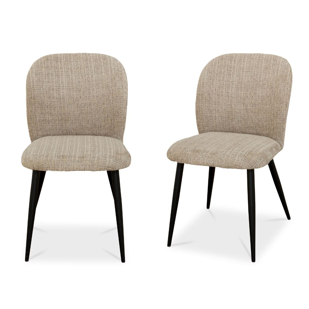 Two beige upholstered chairs with black legs on a white background