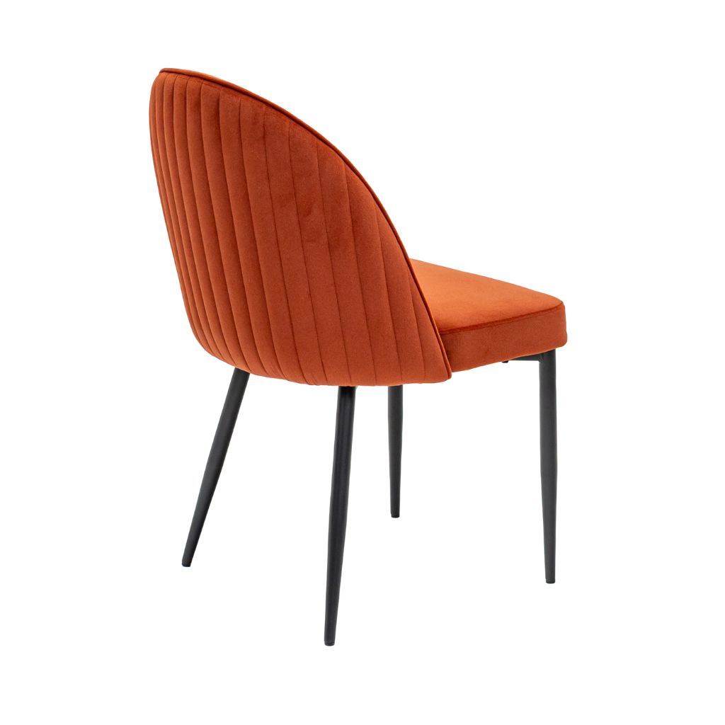 Velvet dining chair with elegant stitching on the back in a gorgeous rust colour
